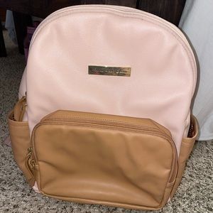 Petunia Pickle Bottom District diaper bag in pink/tan